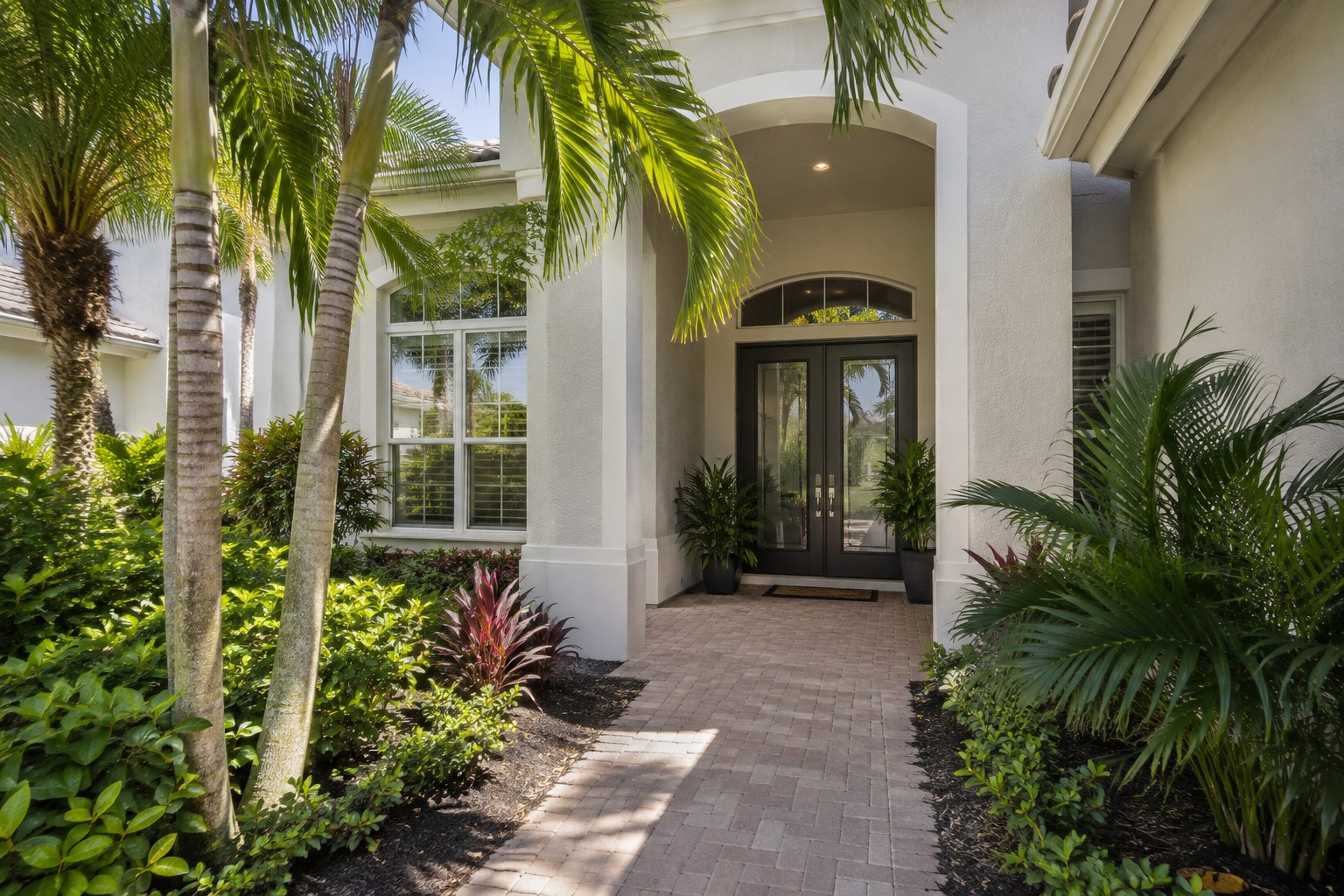 A shaded front entry of a Florida home, illustrative